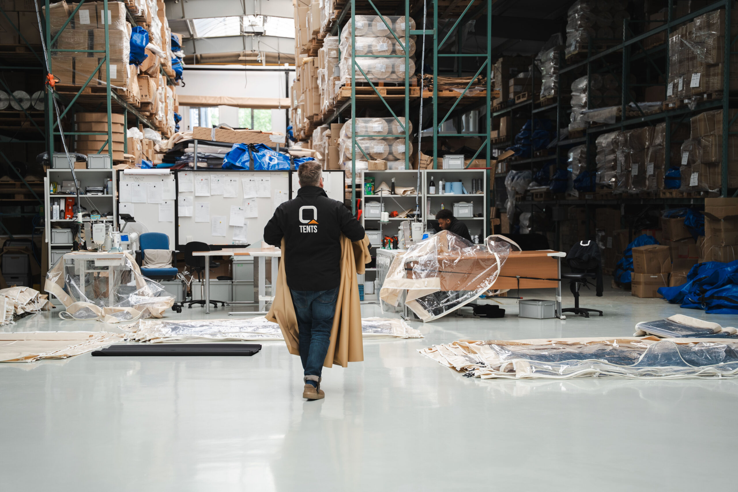 Qtents production floor people working