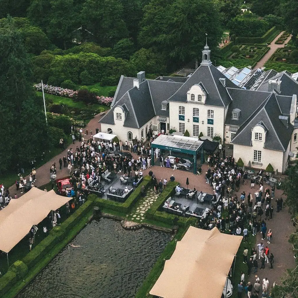 drone shots of Qtents stretch tent next to water at Aurora event sweden