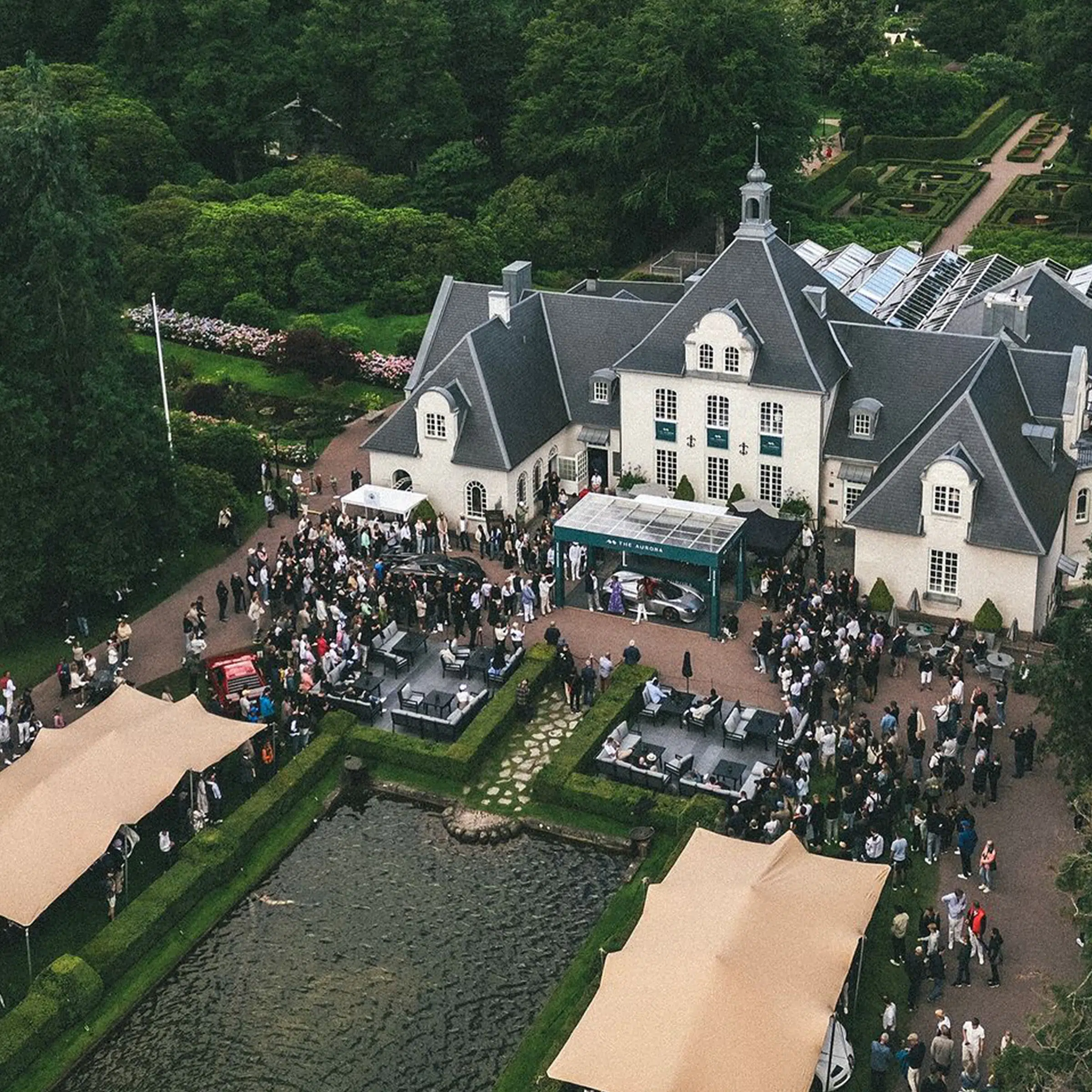 drone shots of Qtents stretch tent next to water at Aurora event sweden